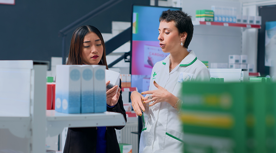 Photo of a pharmacist talking to a customer